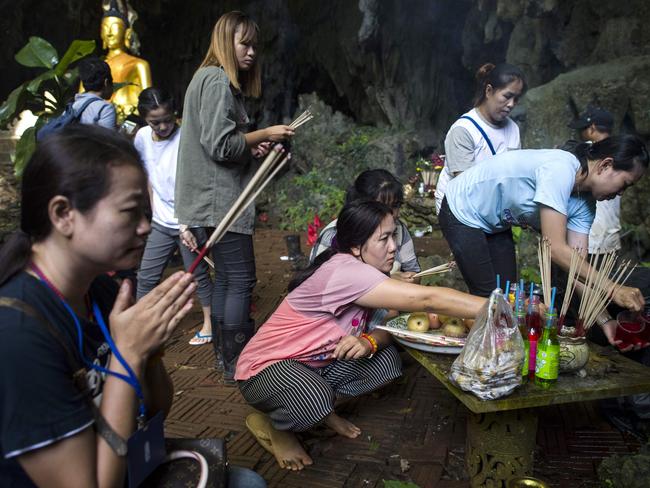 Family members are praying to the safe return of their children, who disappeared on June 23 with their football coach. Picture: AFP Photo / Ye Aung Thu