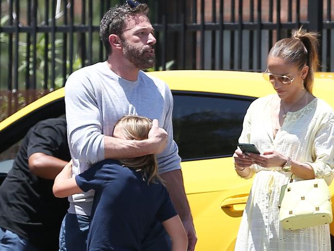 ONE TIME USE US$500 GROUP RIGHTS FOR # PICS -  Sunday, June 26, 2022 - Ben Affleck and Jennifer Lopez are spotted at an exotic car dealership as they look to build upon their already impressive fleet of luxury rides. Ben's son Samuel can be seen sitting up the driver seat and as he revs the engine, the Lamborghini Urus crashes into a parked BMW SUV! A concerned Ben scopes out the damage before negotiating with the salesmen.  Juliano/X17online.com