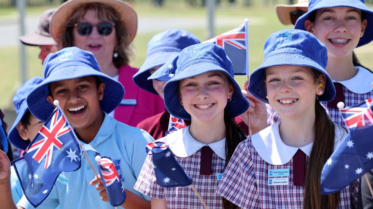 Canberra kids were ready with flags and megawatt smiles for the arrival of the royals. Picture: Chris Jackson/Getty Images