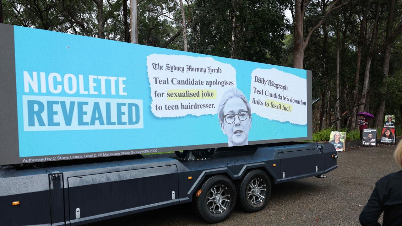 A large sign has been parked on the road leading a voting centre in Gordon. Picture: Rohan Kelly