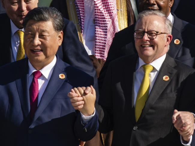 South Africa's President Cyril Ramaphosa, from front row left, China's President Xi Jinping and Australia's Prime Minister Anthony Albanese pose with other G20 leaders at the G20 Summit in Rio de Janeiro, Monday, Nov. 18, 2024. (Eric Lee/The New York Times via AP, Pool)