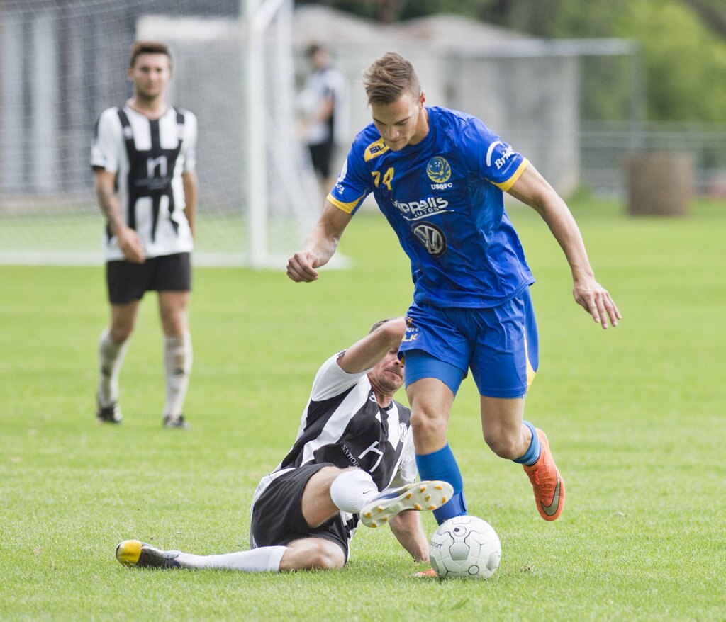 Peter Millican, Willowburn and Daniel Fuller, USQ. Football, Willowburn vs USQ. Sunday, 4th Mar, 2018. Picture: Nev Madsen