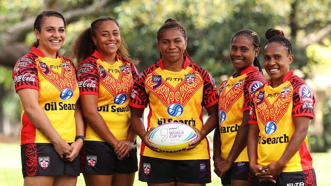 Gloria Kaupa (centre) with her PNG teammates in Sydney. Photo: Brett Costello