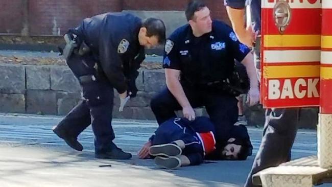 Instagram image of police detaining the man taken into custody after the attack.