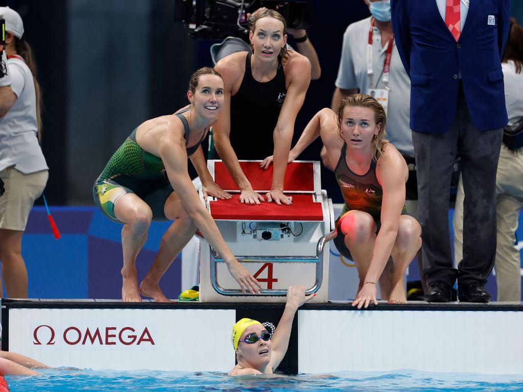 Leah Neale in the pool as 4x200m teammates Ariarne Titmus, Emma McKeon and Madison Wilson look on. Picture: AFP