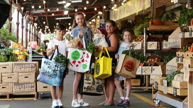 Max Dragwidge, 10, Trixie Sumpter, 13, Matina Dragwidge, 10, and Ruby Sumpter, 8, show off their reusable bags. Picture: Andrew Tabuer.