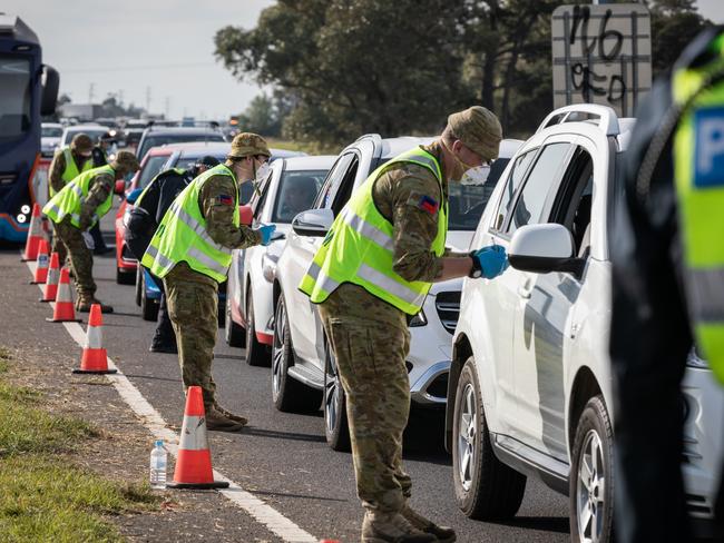 Australian Army Reservists work with Victorian Police Officers at a vehicle checkpoint in Victoria. Picture: Supplied