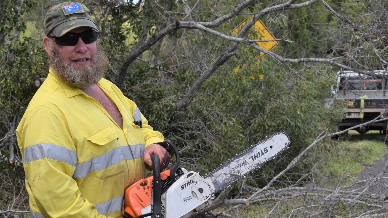 Alan Higgins grabbed his chainsaw, jumped in his car and drove to Bucca from Bundaberg to help clear roads that were littered with fallen trees.