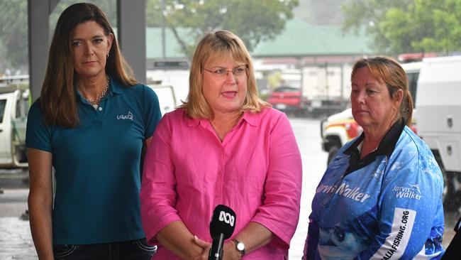 Minister for Local Government and Water and Minister for Fire, Disaster Recovery and Volunteers Ann Leahy, flanked by Local Government Association of Queensland (LGAQ) CEO Alison Smith and Hinchinbrook Shire Council Deputy Mayor Mary Brown, who is also president of the Hinchinbrook Chamber of Commerce. The trio were speaking outside the council headquarters in flood-ravaged Ingham on Tuesday. Picture: Cameron Bates