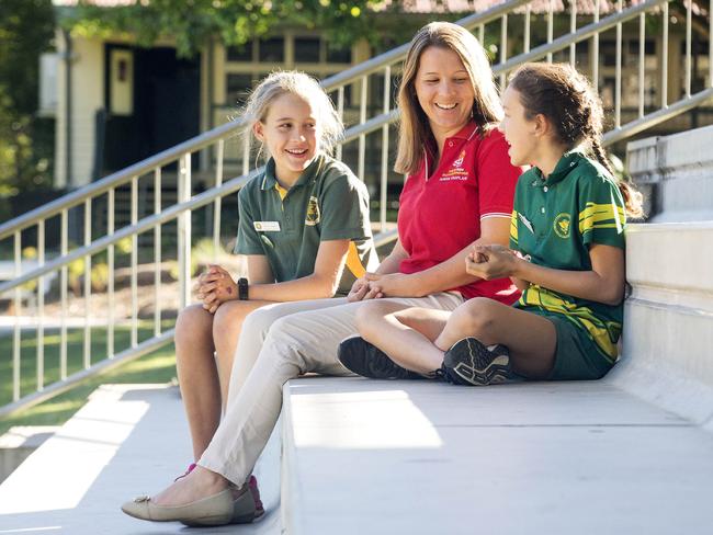 Elimbah State School Chaplin Dorothea Van Lonkhuyzen with students Jessi James (left) and Ruby Ciantar (right).  Elimbah State School in the Queensland electorate of Longman is one of more than 3000 schools that benefits under the Federal Government's $247 million chaplaincy program that faces the axe in the event of Labor winning the next elections. Friday June 1, 2018.