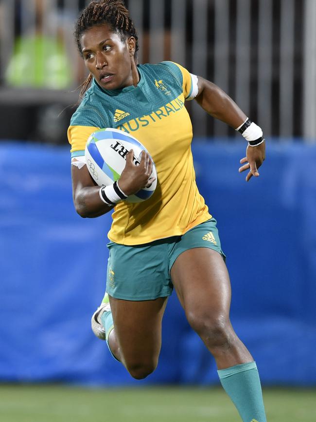 Australia's Ellia Green scores a try in the women’s rugby sevens gold medal match against New Zealand: Picture: AFP.