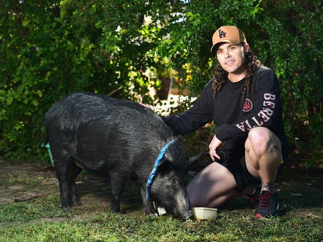 Daniel English with his pet Razerback pig, Missy. Picture: Shae Beplate.