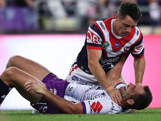 Cooper Cronk and Cameron Smith come to grips during last year’s Grand Final. Picture: Brett Costello