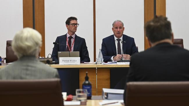 Committee secretary Patrick Hodder with Senator Richard Colbeck as PwC executives are questioned. Picture: Martin Ollman