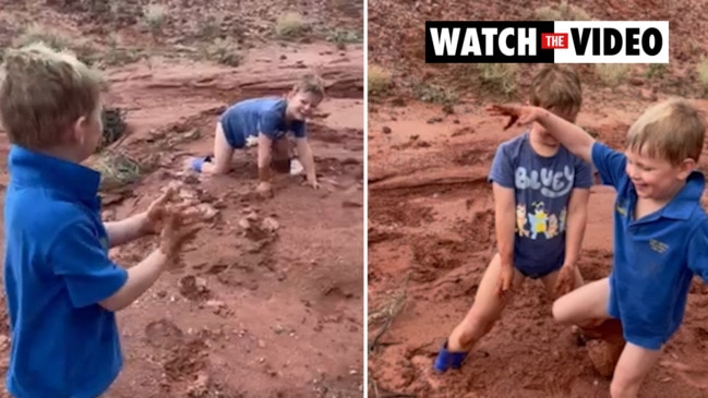 Children play in Kimba mud