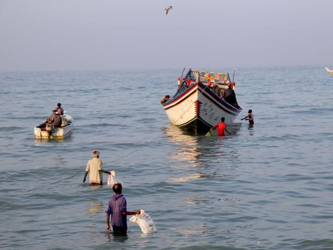 Yemeni fishermen arrive to unload their catch from a boat in al-Khokha district on the southern edge of the Red Sea city of Hodeida. Picture: AFP