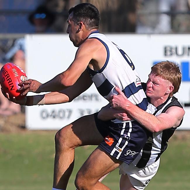 Yarrawonga’s reigning Morris Medal winner Leigh Masters is tackled by Wangaratta’s Fraser Holland-Dean. Picture: Yuri Kouzmin