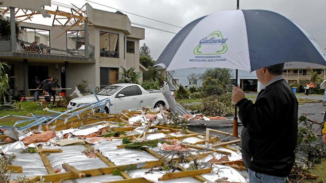 A Lennox Head residient inspecting the trail of destruction left by a tornado that hit the small coast town on June 3 2010.Photo The Northern Star Archives/ Jay Cronan