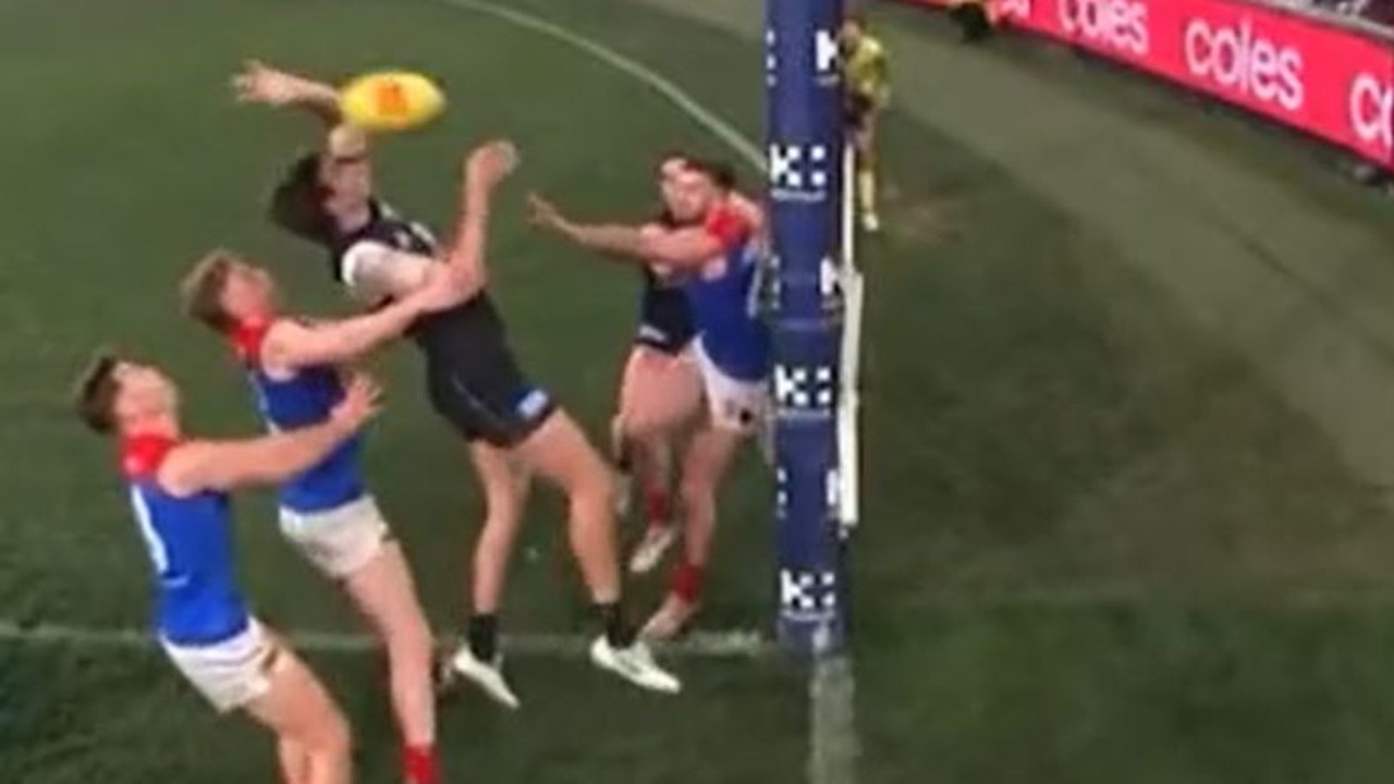 Caleb marchbank claims touch on Christian Petracca "goal". Umpire made soft call of behind. Inconclusive footage to point stands.
