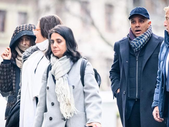 (FILES) Indian-Swiss billionaire family members Namrata Hinduja (L) and Ajay Hinduja (2ndR) arrive at the Genevaâs courthouse with their lawyers Yael Hayat (C) and Robert Assael (R) at the opening day of their trial for human trafficking on January 15, 2024. A Swiss court on June 21, 2024, acquitted four members of Britain's richest family, the Hindujas, of human trafficking charges over treatment of domestic employees. (Photo by GABRIEL MONNET / AFP)