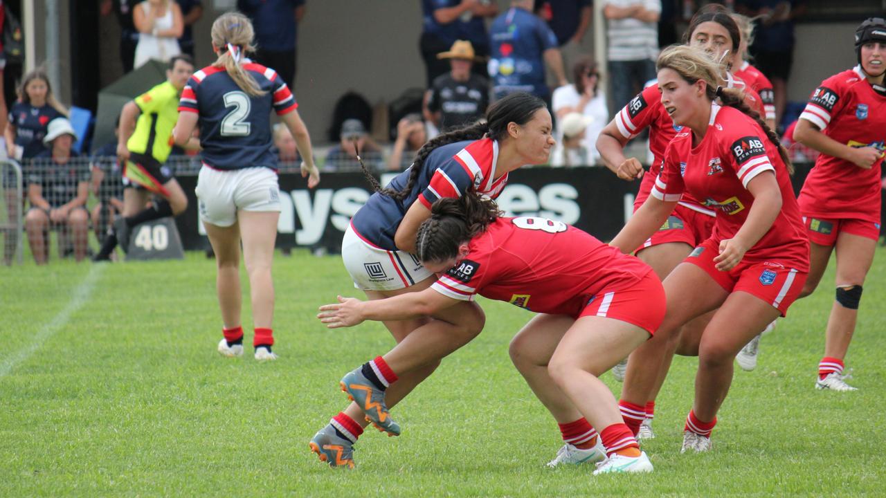 Mele Katu'u is met in the tackle by Hope Millard. Picture: Kevin Merrigan