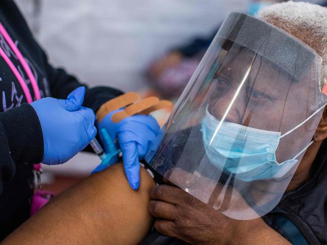 A nurse administers the Moderna Covid-19 vaccine to a woman in Los Angeles. Picture: AFP