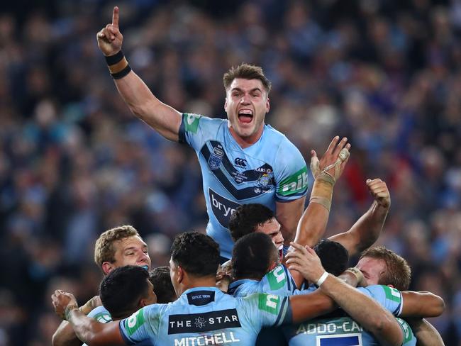 Angus Crichton of the Blues and teammates celebrate winning game two of the State of Origin series between the New South Wales Blues and the Queensland Maroons at ANZ Stadium. Picture: Cameron Spencer/Getty Images