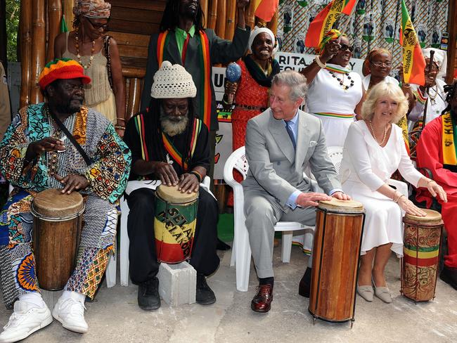 Charles and Camilla play the bongo drums as they join a group of musicians at Bob Marley's former home, now a museum, in Kingston, Jamaica. Picture: Anwar Hussein/WireImage