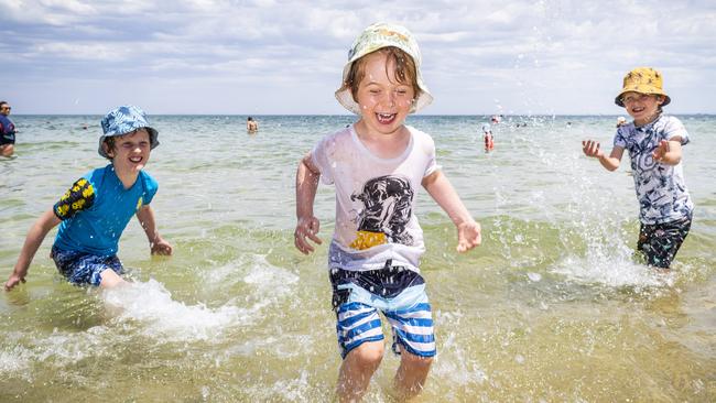 Fenn Davey and brothers Max, 9, Harry, 4, and Felix, 7 cool off in Brighton. Picture: Jake Nowakowski.