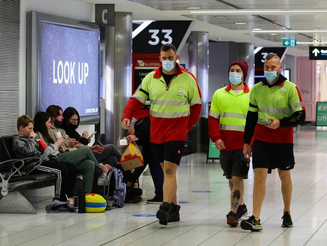 Workers at Sydney Domestic Airport Terminal. Picture: NCA NewsWire / Gaye Gerard