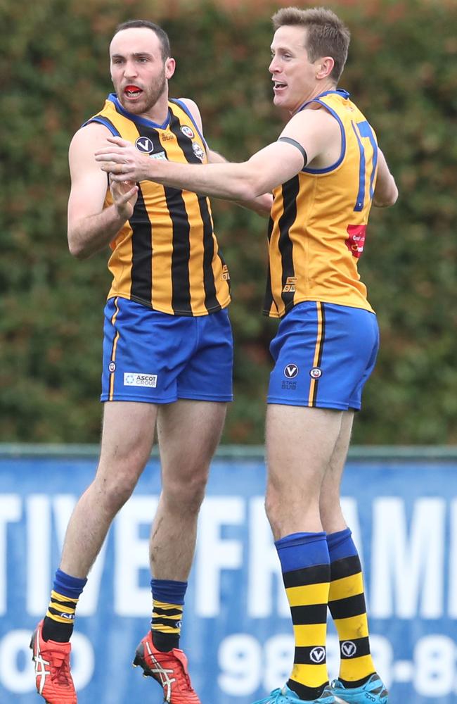 Chad Jones (right) celebrates a goal with Michael Caven during St Bernard’s semi-final win last weekend. Picture: David Crosling