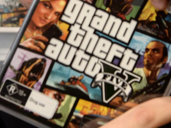 Luke Aspinall, 19, is a gaming fan and has bought the new Grand Theft Auto 5. Pictured at EB Games, Warringah Mall, Brookvale.