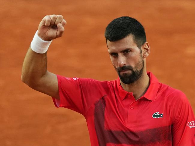 Serbia's Novak Djokovic celebrates his victory over France's Corentin Moutet during their men's singles match on day 5 of the French Open tennis tournament on Court Suzanne-Lenglen at the Roland-Garros Complex in Paris on May 29, 2025. (Photo by Dimitar DILKOFF / AFP)