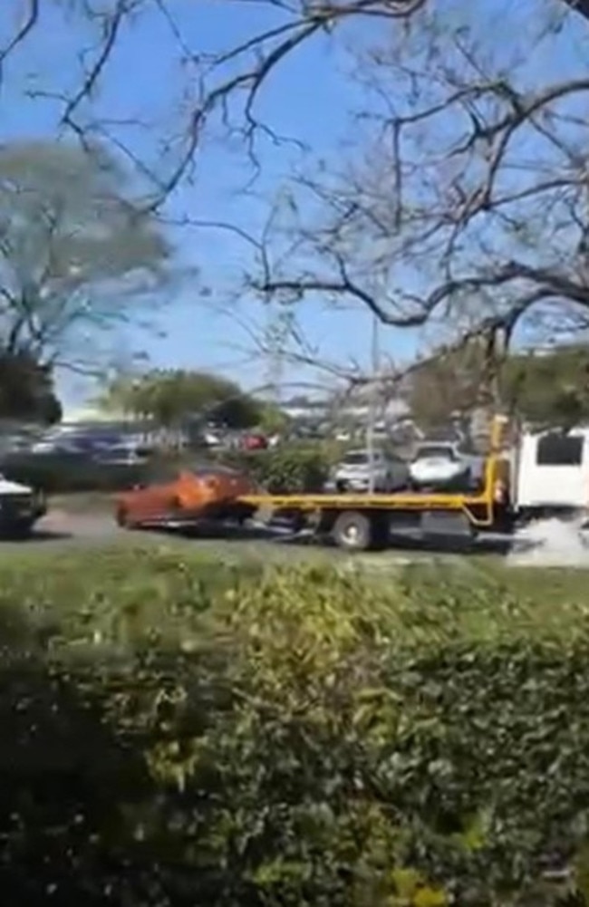 The Holden Commodore being taken away by a tow truck. Picture: Dennis Taunoa