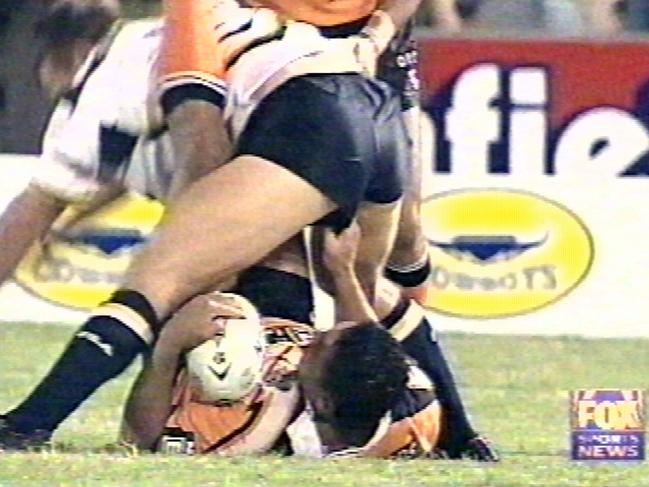 John Hopoate (bottom) interferes with an opponent.