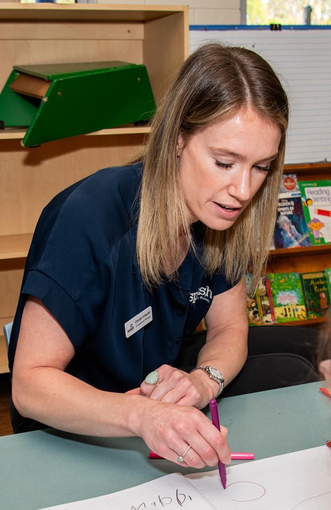 Splash occupational therapist Georgie Schaedel works with a young girl during a pilot NDIS program at Girraween Primary School. Picture: Pema Tamang Pakhrin