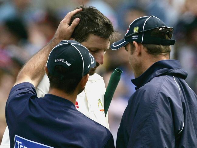 Kasprowicz was consoled by Ricky Ponting and Matthew Hayden after Australia fell two runs short of England in the second Test of the 2005 Ashes series. Picture: Hamish Blair/Getty Images