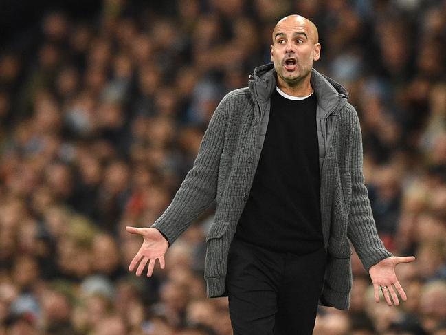 Manchester City's Spanish manager Pep Guardiola reacts to a missed opportunity during a UEFA Champions League group F football match between Manchester City and Shakhtar Donetsk at the Etihad stadium in Manchester, northwest England on November 7, 2018. (Photo by Oli SCARFF / AFP)