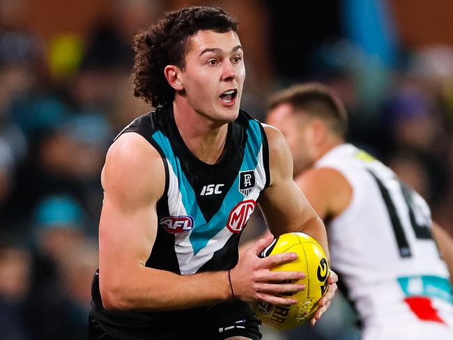 ADELAIDE, AUSTRALIA - JULY 25: Darcy Byrne-Jones of the Power runs with the ball during the round 8 AFL match between Port Adelaide Power and the St Kilda Saints at Adelaide Oval on July 25, 2020 in Adelaide, Australia. (Photo by Daniel Kalisz/Getty Images)