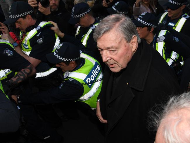 Cardinal George Pell arrives, surrounded by Victorian Police officers at the Melbourne Magistrates Court in Melbourne, Australia, Wednesday, July 26, 2017. Picture: Tracey Nearmy/AAP