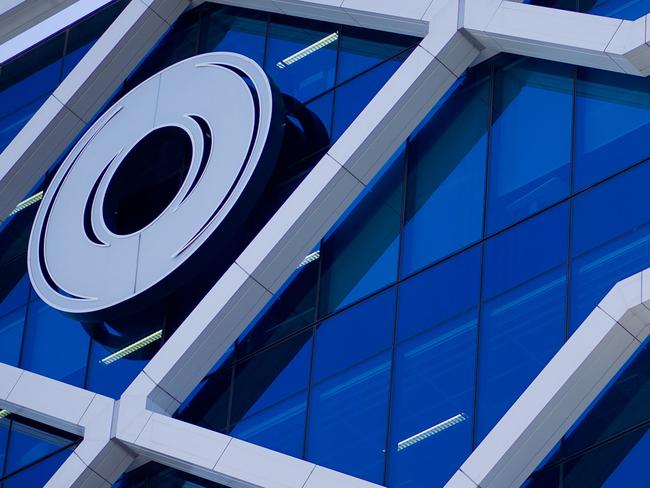 The Macquarie Group Ltd. logo is displayed on the facade of the Macquarie Group Building in Sydney, Australia, on Friday, April 27, 2012. Macquarie Group Ltd., Australia's largest investment bank, said it's relying on cost cuts to revive earnings after a slump in trading income and dealmaking dragged full-year net income to an eight-year low. Photographer: Ian Waldie/Bloomberg