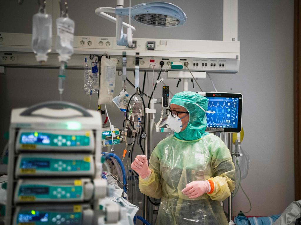 A nurse wearing protective clothing and face mask takes care of a COVID-19 patient at a hospital in Stockholm, Sweden. Picture: Jonathan Nackstrand / AFP