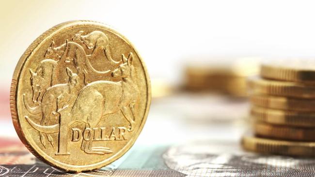 Aussie one dollar coins, on a twenty dollar note.