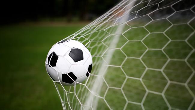 Soccer ball in goal net. Photo: Istock