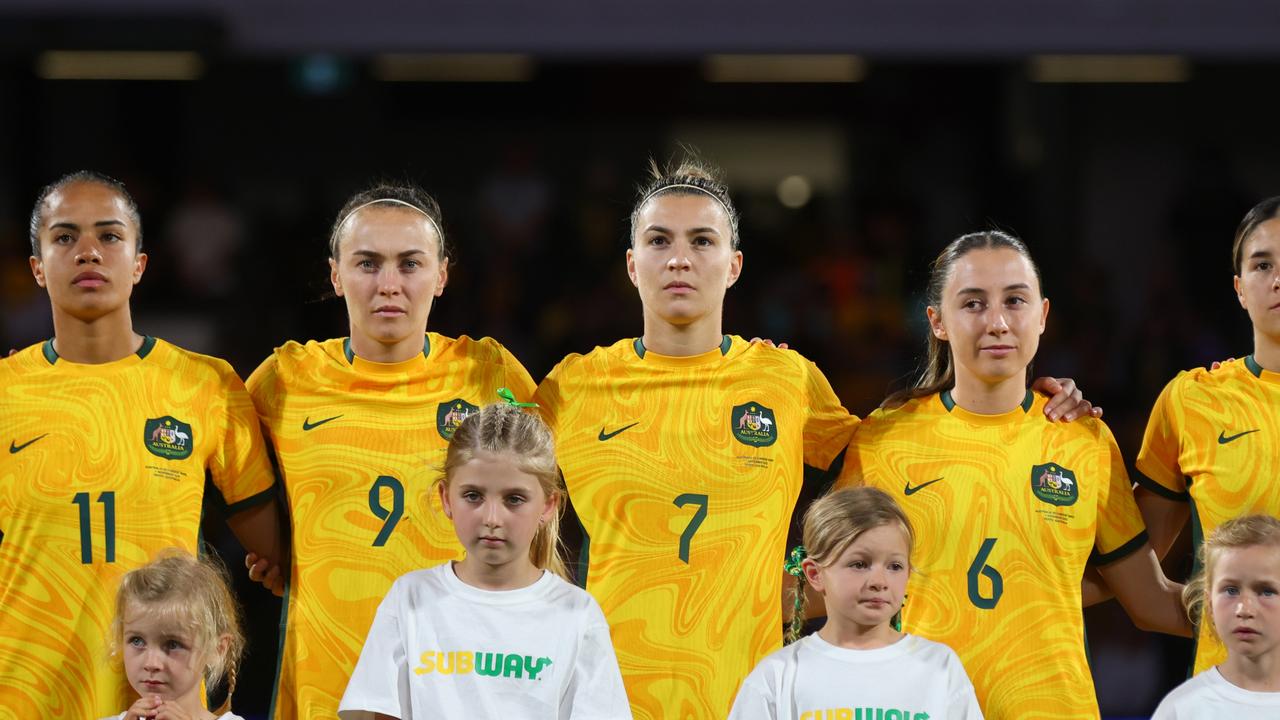 PERTH, AUSTRALIA - NOVEMBER 01: Mary Fowler, Caitlin Foord , Steph Catley, Clare Wheeler and Kyra Cooney-Cross of the Matildas line up for the national anthem during the AFC Women's Asian Olympic Qualifier match between Australia Matildas and Chinese Taipei at HBF Park on November 01, 2023 in Perth, Australia. (Photo by James Worsfold/Getty Images)