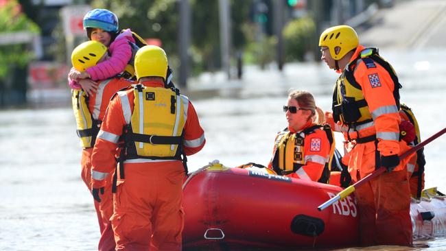 Little girl being rescued by the SES during the Maribyrnong floods. Picture: Nicki Connolly