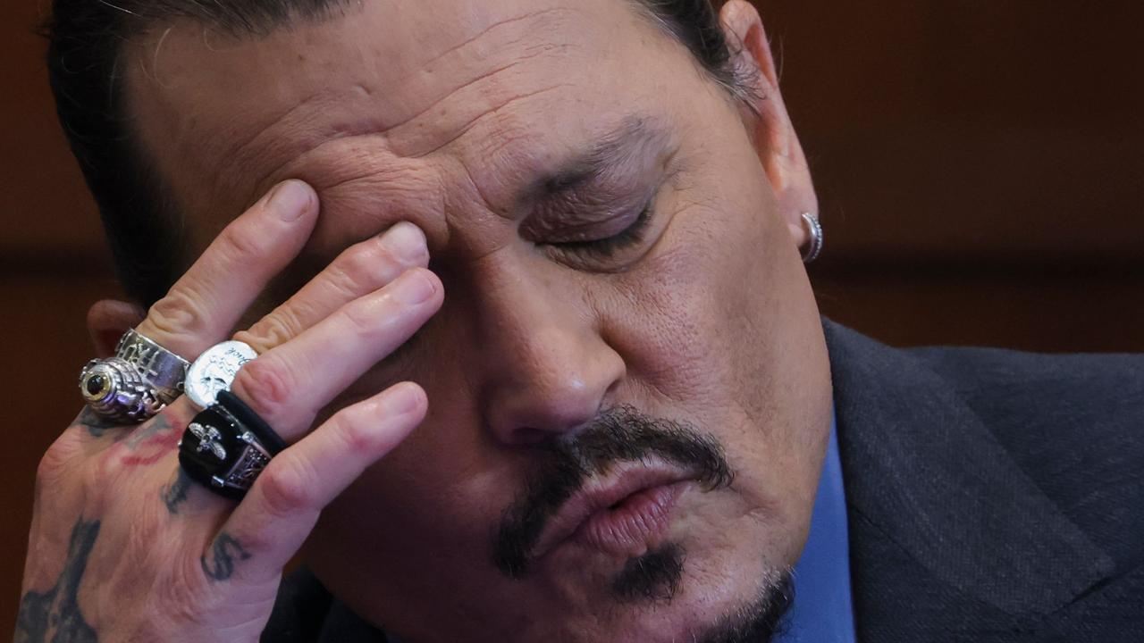 Actor Johnny Depp reacts as he testifies in the courtroom during his defamation trial against his ex-wife Amber Heard, at the Fairfax County Circuit Courthouse in Fairfax, Virginia, on May 25. (Photo by EVELYN HOCKSTEIN / POOL / AFP)