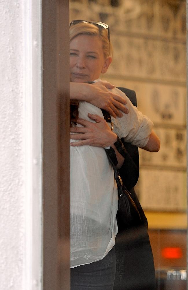 Blanchett and Adams embrace inside the tatto parlour. Picture: NPG