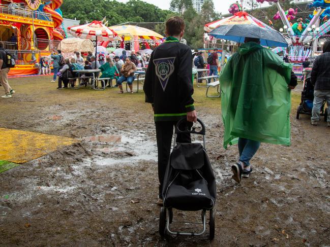 Punters braving wet weather at the Ekka on Monday.