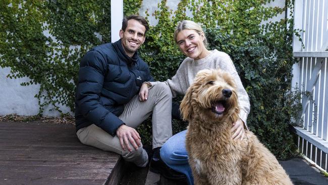 Nick Murnane and partner Ellen Russell, with dog Peanuts, are part of the millennial generation that have caught up with the baby boomers. Picture: Aaron Francis / The Australian